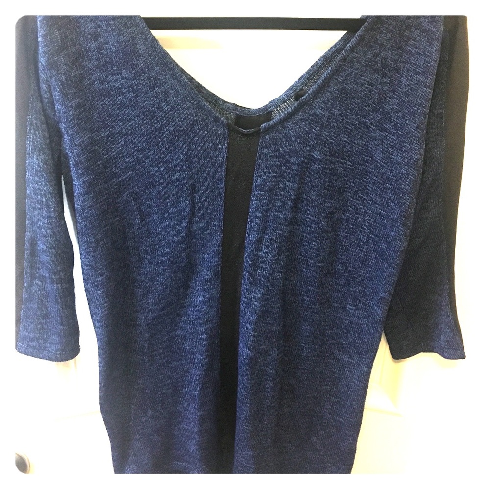 Like new light sweater with patent leather trim!